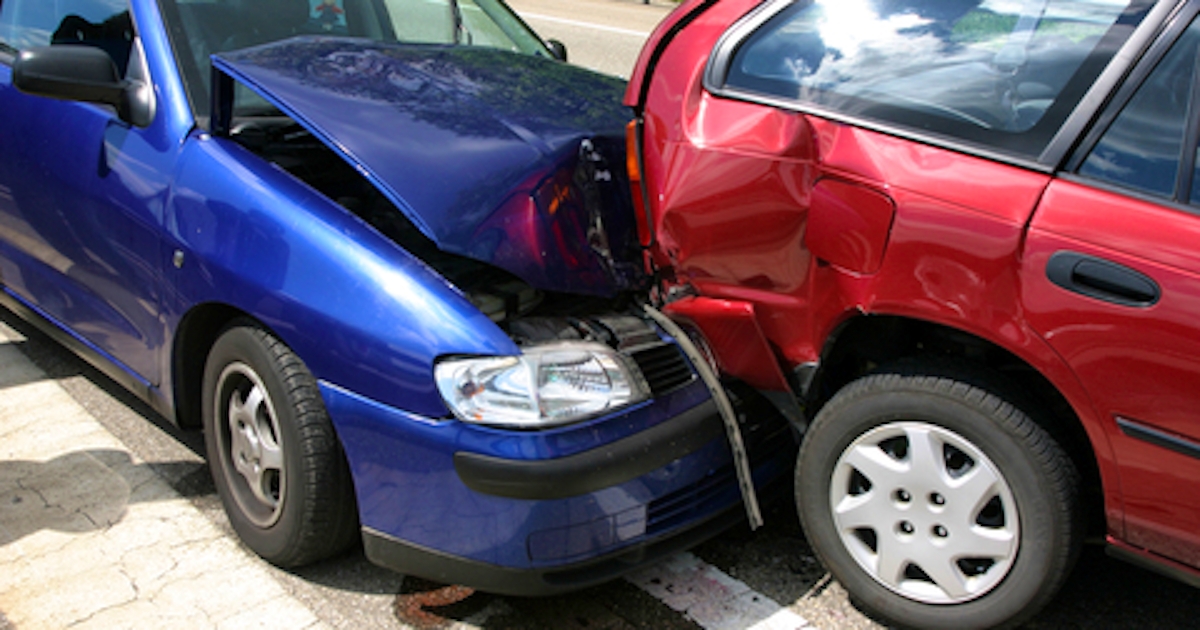 The image shows a blue car with significant front damage and a red car that is rear-ended. Both vehicles are on a road, indicating a collision.